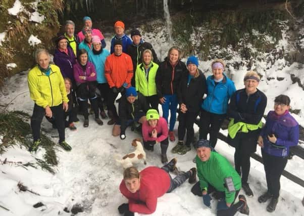 A group of FTR members take a break from their snowy Sunday run up Maspie Nen in the Falkland Estate.