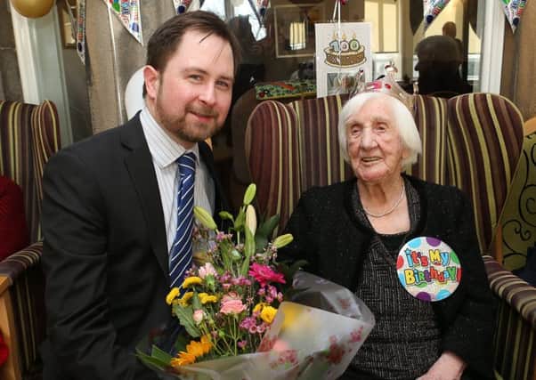 Nancy receives flowers from Councillor Richard Watt