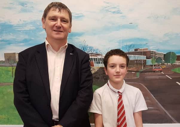 First year Glenwood High pupil Evan Anderson with Peter Grant MP.