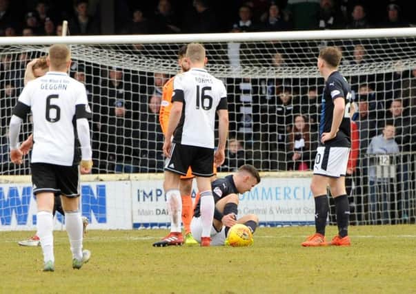Ross Matthews on the ground after alleged stamp by Lawrence Shankland  - credit- Fife Photo Agency