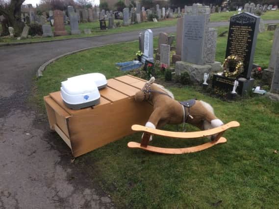 Heartless fly-tippers dumped the items on the grass verge beside the graves.