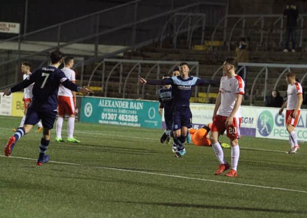 Forfar celebrate Matthew Aitken's opener after Raith goalkeeper Aaron Lennox dropped a cross at the feet of the Forfar striker. Pic: Chris Coutts
