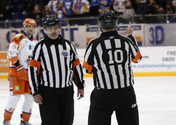 Alan Craig and fellow ref Neil Wilson discuss the Fife Flyers goal was that subsequently disallowed (Pic: Steve Gunn)