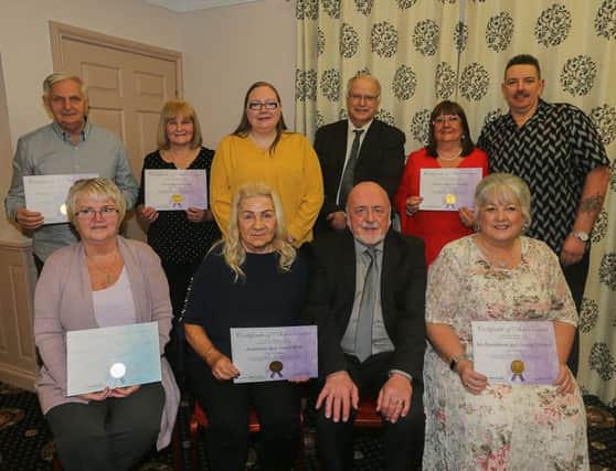Cllr Fay Sinclair (back row 3rd from left and Cllr David Ross (back row 4th from left) with some of the foster carers and their partners who received awards