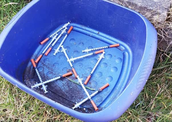 12 needles were found spread over the garden.