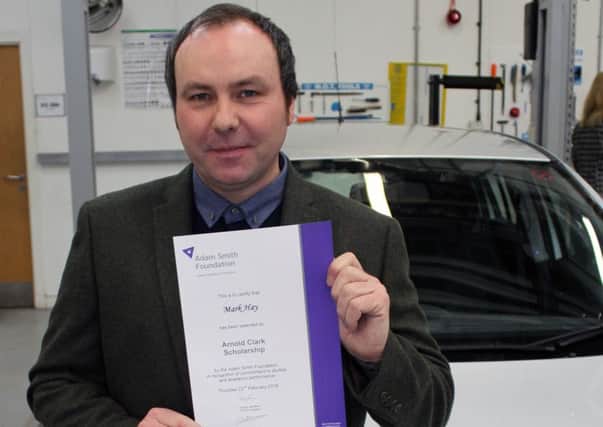 Former police officer, Mark Hay from Kirkcaldy, with his certificate.