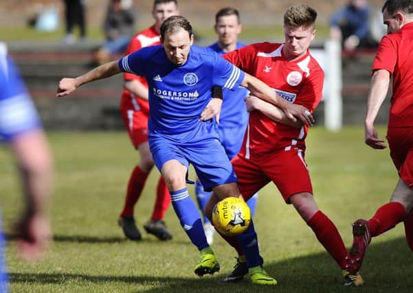 Action from Dundonalds defeat to Camelon on Saturday.  Pic: Alan Murray