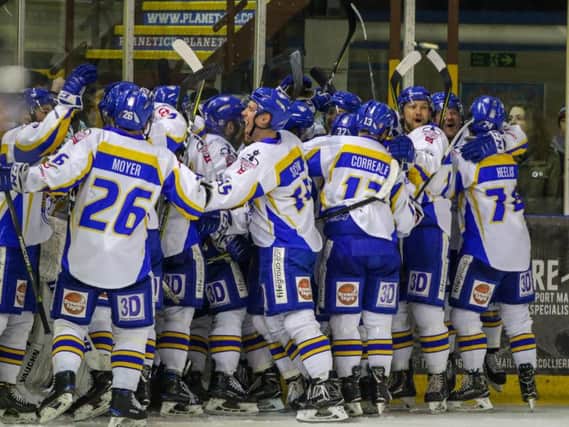 Fife Flyers players celebrate reaching the EIHL play-off finals after Carlo Finucci's overtime winner in Manchester. Pic: Mark Ferriss
