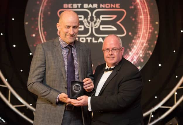 Best Bar None Awards Pinkertons awarded platinum award
(left to right) Mark Anderson (who accepted the award on behalf of Pinkertons) and Jack Gemmell (Chivas Brothers - Pernod Ricard) who presented the award. Image by Imagine Images