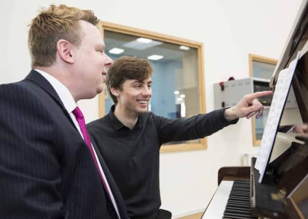Mikael Petersson, music planning co-ordinator and pianist at Elmhurst Ballet School with Connor Wilcox.