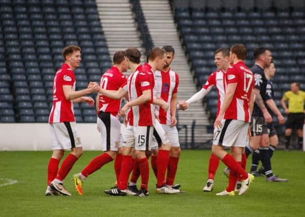 The Fifers celebrate with Pat Slattery (far left) after his winner at the weekend.