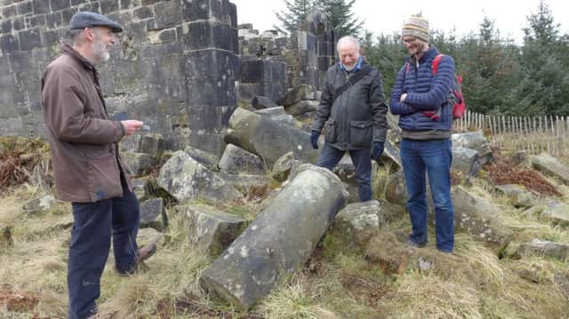 Peter Jones examining the Temple of Decision with Ninian Stuart and landscape architect Derek Carter.