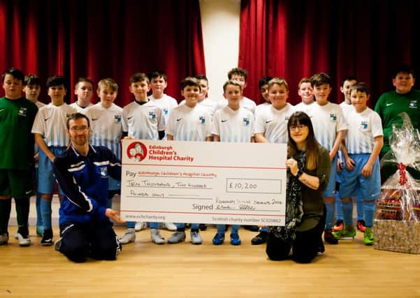 Kennoway Soccer Sevens with the cheque.