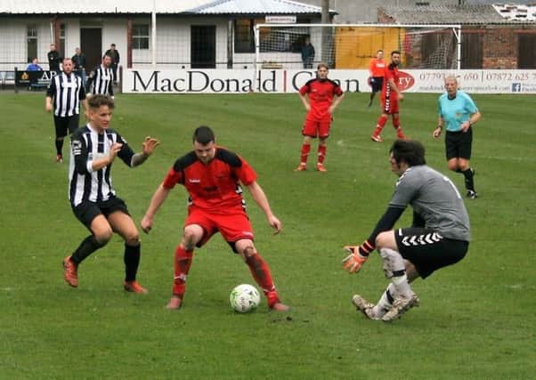 Vics scramble back to cut out a Newburgh attack. Picture by Graham Strachan.