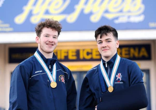 Reece Cochrane (left) and Calum Robertson with their U18 World Championship gold medals at Fife Ice Arena. Pic: Fife Photo Agency