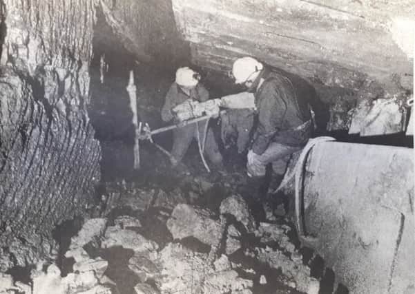 Workers at Kirkcaldy's Seafield Colliery pumping liquid cement into the rock face in 1985