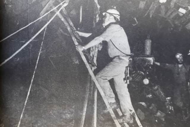 Manager of Seafield Colliery in Kirkcaldy, George Caldow, climbs to the pit face in 1985