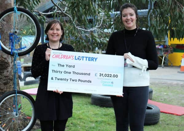 From left: Anna Robinson and Hannah Mitchell from The Yard with the lottery cash funding. Pic: Delphine Porre.
