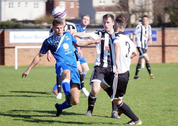 Saints midfielder Dylan Honeyman looks to win back the ball. Pic by George Wallace.