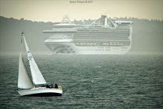 A Burntisland Sailing Club boat passes a cruise ship in the Forth. Pic by Jenny Dingwall.