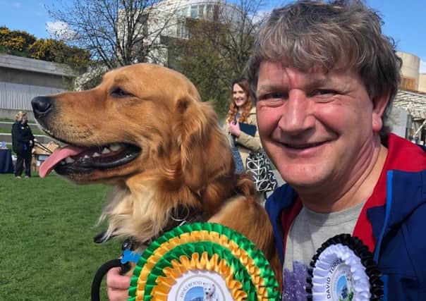 Kirkcaldy MSP David Torrance with Buster in the Holyrood Dog Of The Year Show.