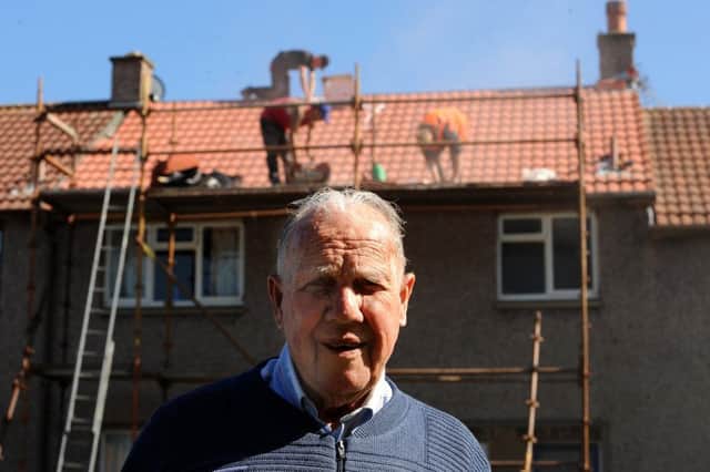 Jimmy outside his home which has been re-roofed for free. Pics by FPA