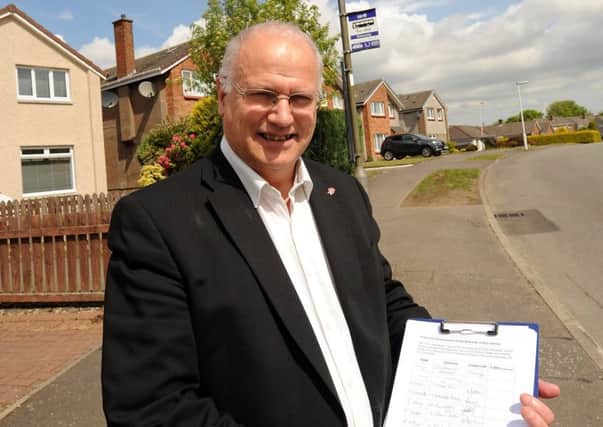 Councillor Ross with last year's petition from Dunnikier Estate residents