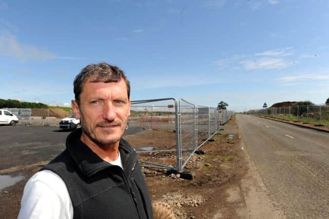 Roy Mackie at the site of the road closure