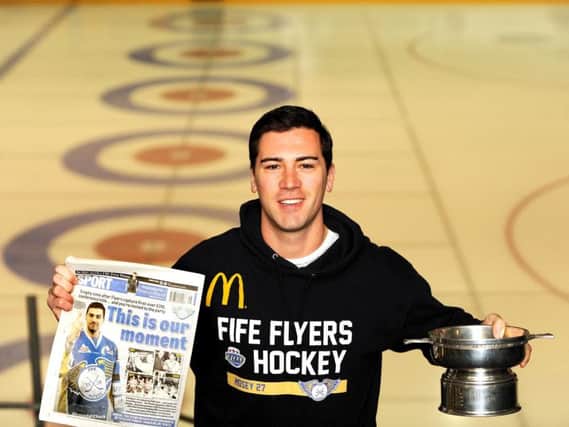 Charlie Mosey with the Mirror of Merit trophy and a back page of the Fife Free Press featuring the clubs conference win. Pic: Fife Photo Agency