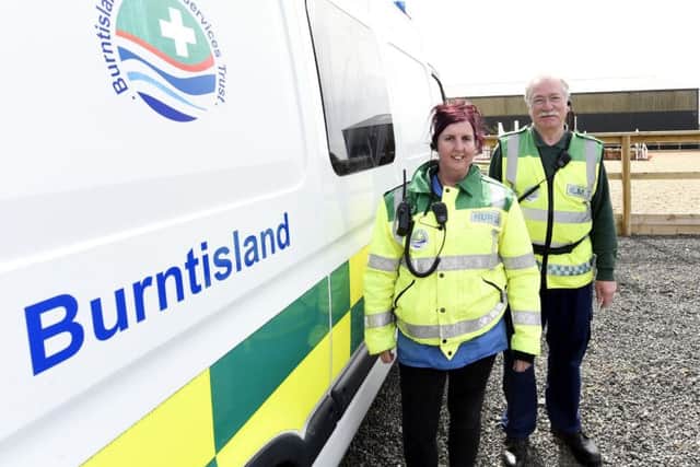 Polly and Alex with their current ambulance