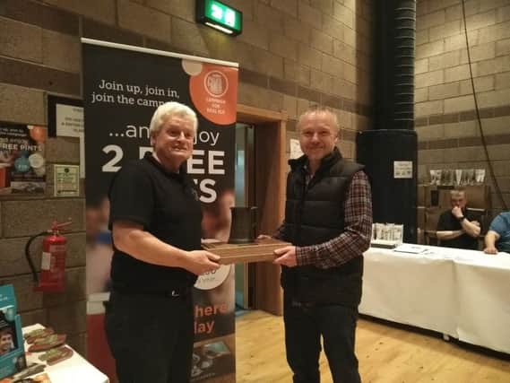 Martin Doherty is pictured receiving the Kenny Broadbent Memorial award for Champion Beer of Fife from festival organiser and Fife CAMRA member John Reade