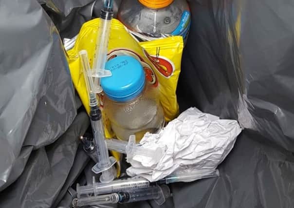 Drug needles dumped in a bus stop bin and in the basket of a pensioner's disability scooter.