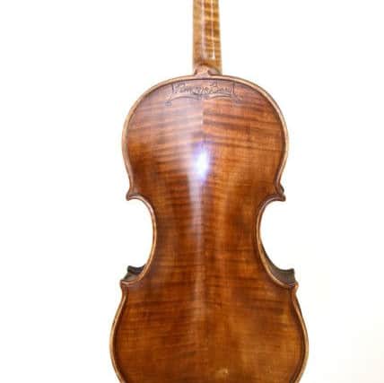 The Dunsire violin with maker Peter Berry's signature on the back. Pic:  Fife Photo Agency.