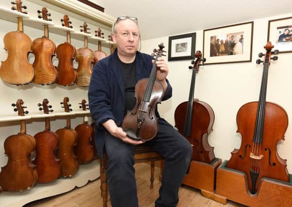 David Rattray with Private Robert Dunsire's violin. Pic:  Fife Photo Agency.