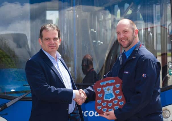 Winner Ian Sayer-Field being awarded his best driver shielf by managing director Paul Thomas