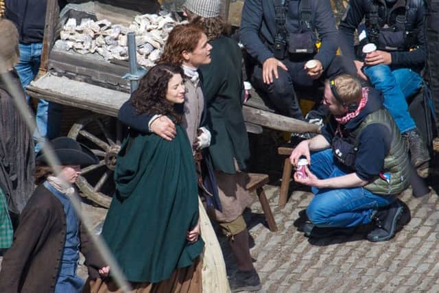 Sam Heughan (Jamie) and Caitriona Balfe (Claire) on the set of Outlander at Dysart harbour. Pics by Steven Brown.