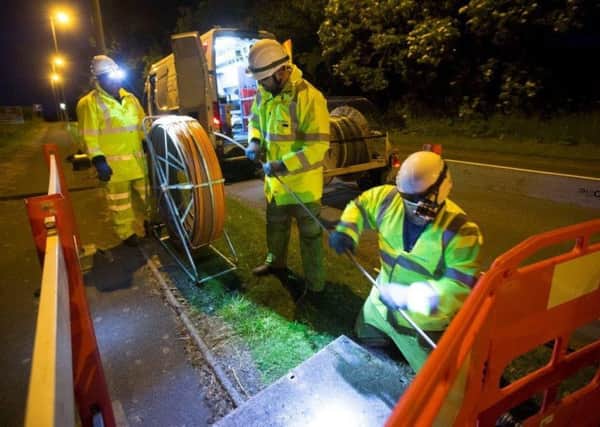 Cable being led by engineers which will give more Fife premises access to Superfast Broadband.