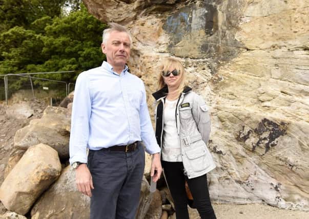 Cllr Cameron and Joleen Carrington at the site of the rockfall. Pics by FPA