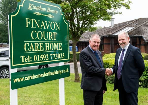 Charlie Dickson, Bield director of housing and care services, and Colin Smart, managing director of Kingdom Homes, shake on the deal which will see Kingdom take over the running of Finavon Care Home (Photo: Wullie Marr Photography)