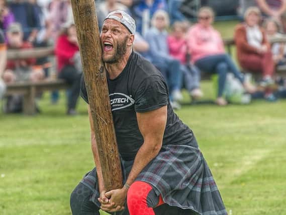 Vlad Tulacek tossing the caber at Markinch Highland Games (picture: Nige Hutchsion)