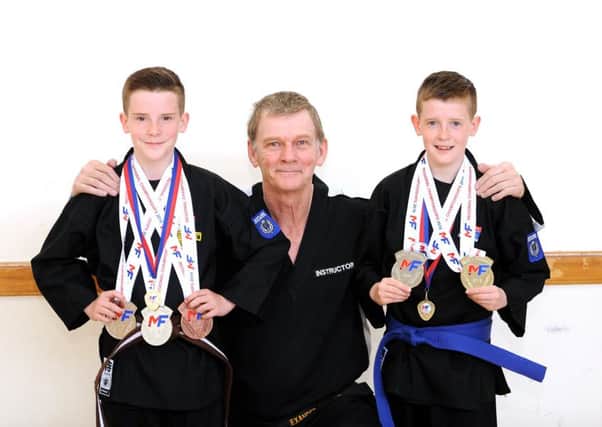Philp Hall - Links St -  Kirkcaldy - Fife - 
Twins Connor & Dean Loughran , age 12,  who won medals at a national kick-boxing championships  - with martial arts instructor Alex Hunter - 
credit- WALTER NEILSON