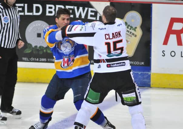 Neil Clark (Sheffield Steelers) and Matt Siddall (Flyers) go toe to toe right from the opening face off (Pic: Richard Davies)