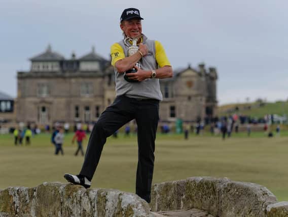 Miguel Angel Jimenez proudly clutches his Senior Open top prize. Picture by John Stewart,