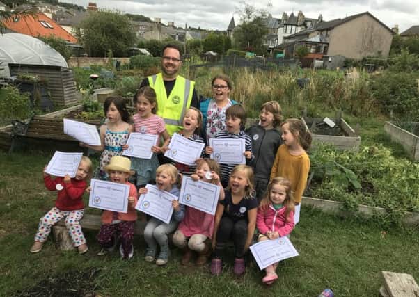 Scott with the young gardeners