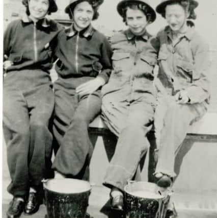 M&S Kirkcaldy store air raid precaution team fire-watching on the store roof in 1941.  During the Second World War staff volunteered to fire-watch on the store roof and were trained in Air Raid Precaution methods. May Hutchison is pictured on the far left and Marion Cotterill  is shown second-right in the photograph.  Pic: Marks & Spencer Company Archive.
