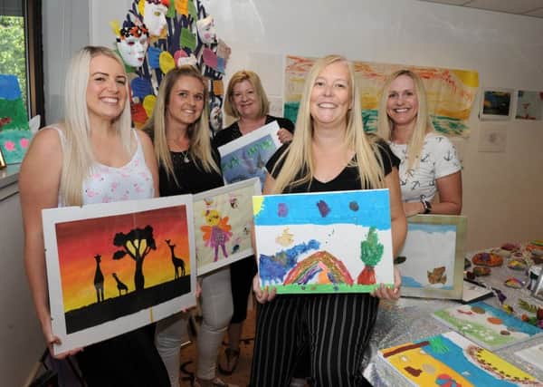Staff at the Fife Women's Aid annual Children and Young People's Art Exhibition. From left: Natalie Thomson, Val Symon, Gil Birtley, Keri Duffy and Ingrid Gordon. Pic: George McLuskie Photography.