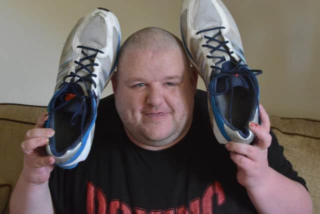 David Henderson with his size 29 trainers.