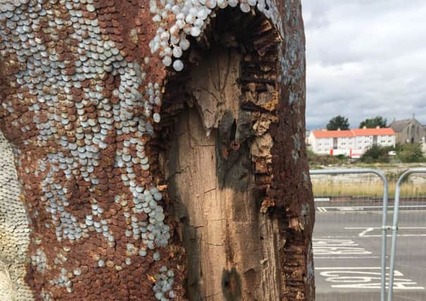 Pieces of the controversial David Mach sculpture are now falling off sparking safety fears.