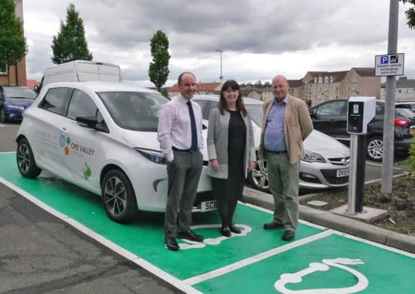 Business Development Manager Nick Clark, Board Chair Susan McDonald and CEO Andrew Saunders with the new Renault Zoe electric car and charging points at the Ore Valley Business Centre.