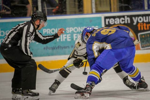 Graham Rodger, from Leven drops the puck for a face off in the game betweent Fife Flyers against University of Manitoba Bisons (Pic: Jillian McFarlane)